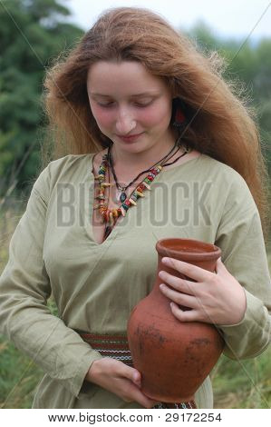 KIEV, UKRAINE - JULY 31: Member of history club Golden Capricorn wears medieval costume as she participates in historical festival in memory of King Vladimir July 31, 2009 in Kiev, Ukraine.