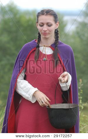 KIEV, UKRAINE - JULY 31: Member of history club Golden Capricorn wears medieval costume as she participates in historical festival in memory of King Vladimir July 31, 2009 in Kiev, Ukraine.