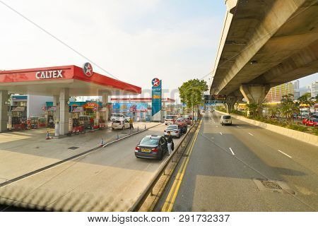 HONG KONG, CHINA - CIRCA JANUARY, 2019: Caltex petrol station seen from second desk of double-decker bus in Hong Kong in the daytime. 