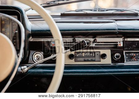 Retro Styled Image Of An Old Car Radio And Dashboard Inside A Classic Car