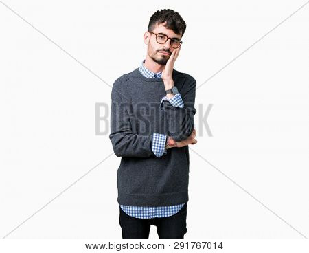 Young handsome smart man wearing glasses over isolated background thinking looking tired and bored with depression problems with crossed arms.