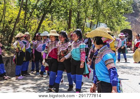 Yuanyang County, Yunnan, China - 2014: Hani Minority Villagers Returning Home After A Funeral Proces
