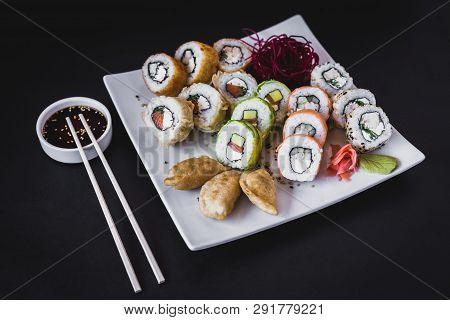 Hot Sushi Rolls Table With Gyoza And Soy Sauce