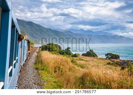 Scenic train ride along Pacific ocean coast in Canterbury regoin, South Island of New Zealand