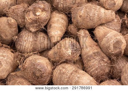 Heap Of Raw Dasheen Roots Close-up In A Chinese Market, Chengdu, China
