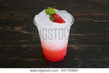 Red Italian Soda Cold Beverage And Strawberry Fruit And Parsley. Red Italian Soda Cold Beverage With