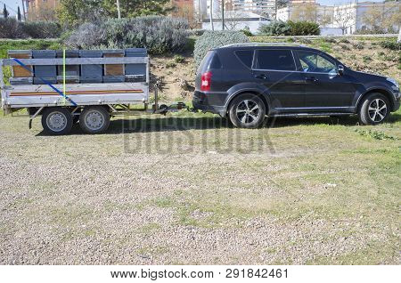 Trailer Load With Wooden Hives Ready To Move. All-road Vehicule Hooked