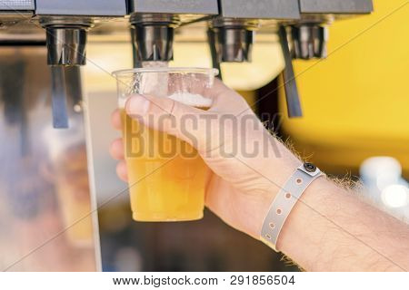 Man Pouring Fresh Drink In Self Service Bar