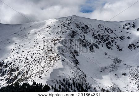Snowy Hills In Low Tatras Mountains. Winter Peaks Landscape And Clouds On The Sky
