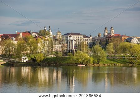 View at island of Tears memorial, Traetskae Pradmestse (Trinity Suburb) and upper town in Minsk, Belarus. Minsk cityscape in spring, Belarus.