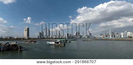 Old Fishing Boats Near Fish Market In Panama City With Skyline Background