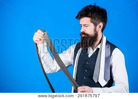 This Grey Tie Is Just The Accessory. Brutal Hipster Holding Luxury Tie Collection. Bearded Man Choos
