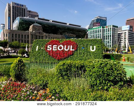 Seoul, South Korea - June 3, 2017: Big Flowerbed With Inscription Against The Background Of A Red He