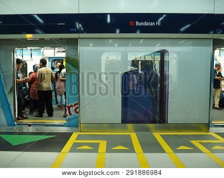 Jakarta, Indonesia - March 23, 2019: People Getting On The Train At Bundaran Hi Mrt Station.