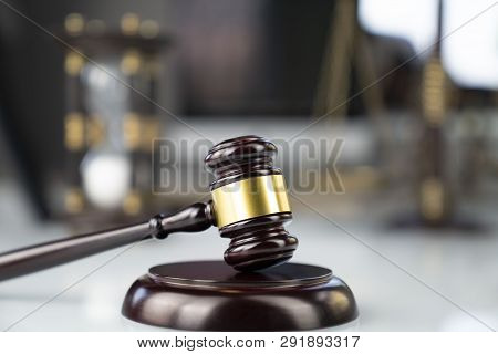 Lawyers Office. Gavel, Scale And Computer On The White Table.