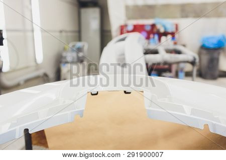 Repair Of The Rear Bumper Of A White Car After An Accident With The Help Of Multi-colored Putty In A