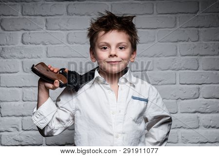 Happy Smiling Small Boy With Big Gun On Brick Wall Background Weapon License Concept