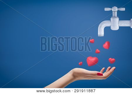 Side Crop Close-up Of Womans Hand Facing Up And Catching Cute Red Hearts Coming From Grey Tap On Blu