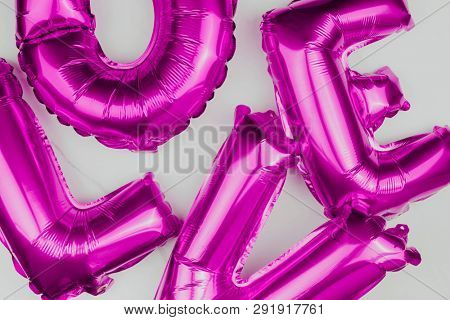 Purple love blown up balloons