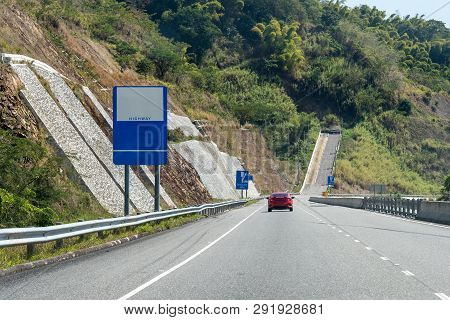 Escape Lane Ahead On Highway Through Mountains On Caribbean Island