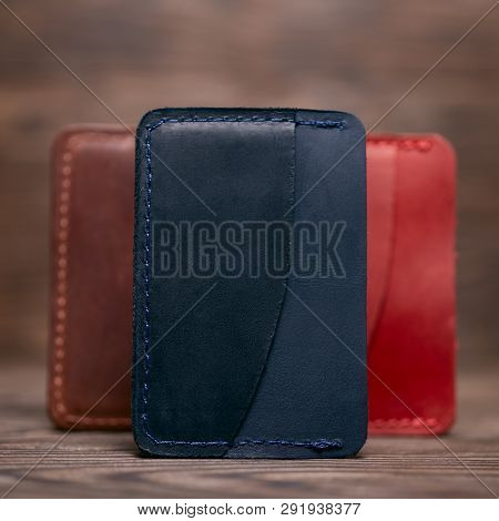 One Pocket Blue Leather Handmade Cardholder. On Blurred Background Stay Other Colour Cardholders. St