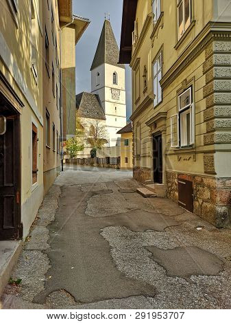 Parish Church Of St. Paul Of The 13th Century, Photographed On A Sunny Autumn Day. Town Of Bad Ausse