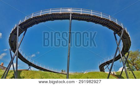 View Of A Round Pedestrian Bridge, Against A Blue Sky.. Zarasai, Lituania.