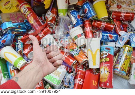 Many Wrappings And Cans From Used Products By Famous Worldwide Brands. Pattern Of Trash Of Various C
