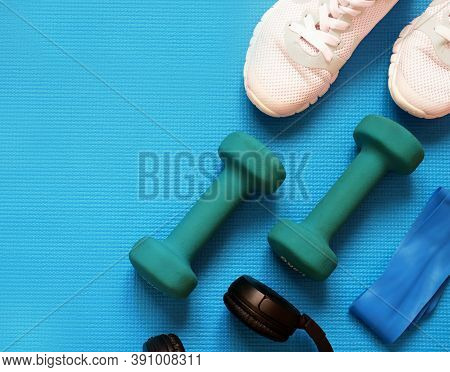 Sport Fitness Concept, Space For Text, Black Sneakers, Blue Dumbbells, Headphones, Fitness Jump Rope