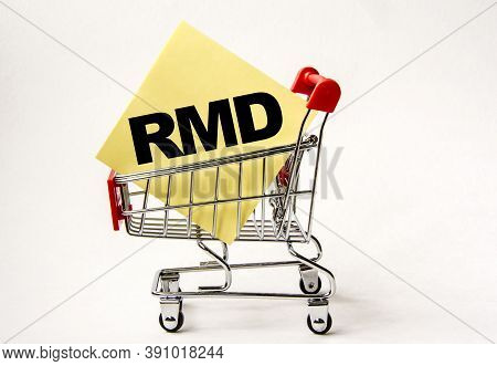 Shopping Cart And Text Rmd On Yellow Paper Note List. Shopping List, Business Concept On White Backg
