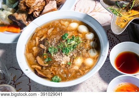 Chinese Style Soup; Or Braised Fish Maw In Red Gravy With Eggs, Mushroom, And Bamboo Shoot In White 
