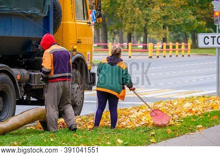 Moscow. Russia. October 11, 2020. Utility Workers Remove Yellow Autumn Leaves With An Industrial Vac