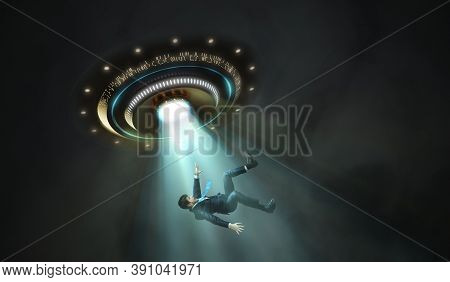 Alien Abduction Concept. Young Man Is Abducted By Ufo.