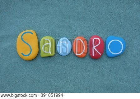 Sandro, Italian Male Given Name Composed With Multicolored Stone Letters Over Green Sand