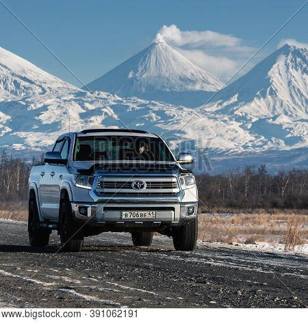 Japanese Sport Utility Vehicle Toyota Tundra Driving Along Road On Background Of Kamchatka Winter La