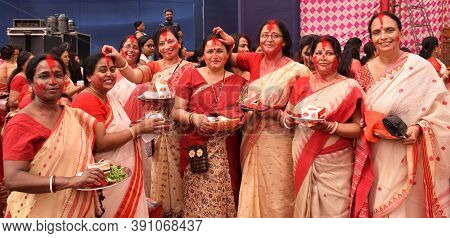 Delhi - India 
10th Oct 2019
Indian Bengali Women Playing With Vermilion Also Known As Sindoor Khela