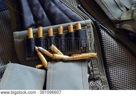 Ammunition 7,62*39.Tactical unloading vest as background. October 23, 2020.Kiev,Ukraine