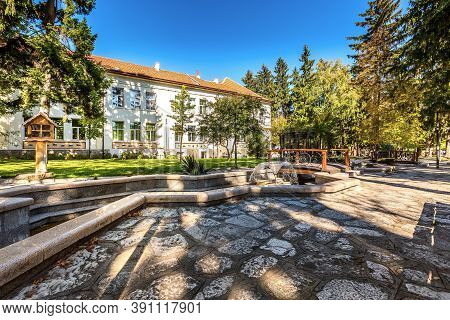 Razlog, Bulgaria Downtown Street Panoramic View With Autumn Trees And Fountains