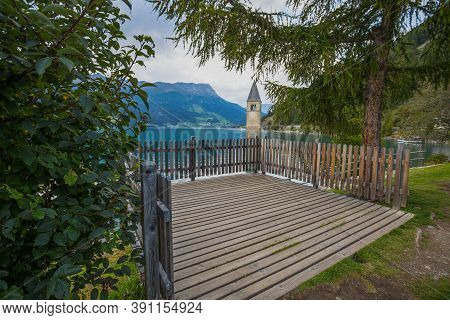 The Bell Tower Of The Sunken Church In Curon, Resia Lake, Bolzano Province, South Tyrol, Italy.