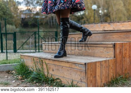A Joyful Lady Is Walking Up The Stairs In Burgundy Palla And Biret, An Adult With A Beautiful Smile 