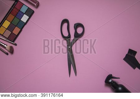 Makeup Brushes And Palette On A Pink Background