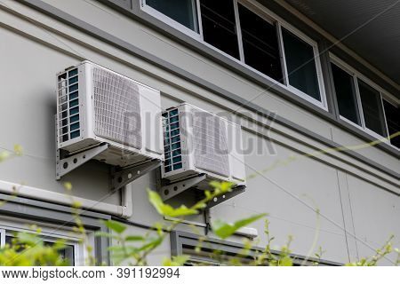 Air Conditioner Compressor Installed In Old Building. Outdoor Split Wall Type Air Conditioner Compre