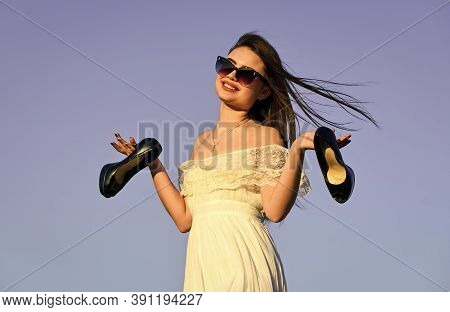 Woman On Sunny Morning Blue Sky. Summer Holidays. Model Tender Summer Dress. Freedom. Girl In Sungla