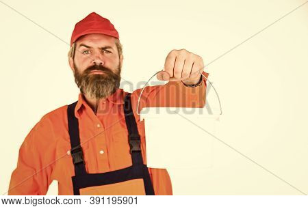Painting Walls. Priming Entire Wall. Bearded Mature Man Painter. Wall Painter With Painting Tool. Hi