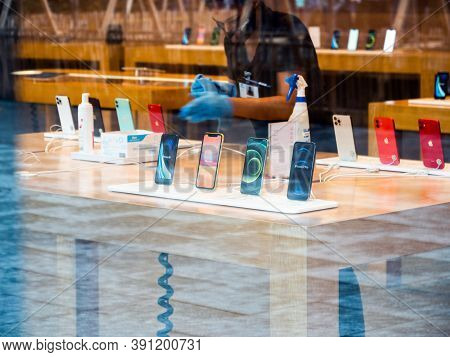 Paris, France - Oct 23, 2020: Silhouette Of Female Worker Cleaning With Alcohol Hand Gel Disinfectan