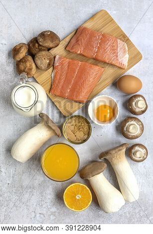 Vertical Composition With Products Rich In Vitamin D. Canned Tuna, Mushrooms, Salmon, Eggs, Milk, An