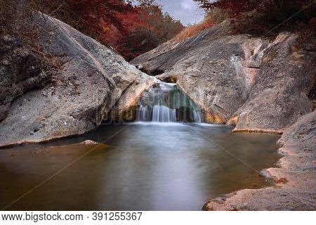 Water Flowing Over Rocks At La Gavave Waterfalls In Apuseni Mountains, Romania