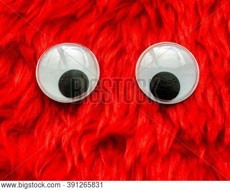 Funny Wiggle Google Eyes On Fabric Silly Fur Carpet Background