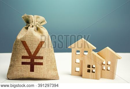 Yuan Yen Money Bag And Residential Buildings. Mortgage Loan. City Municipal Budget. Costs Of Service