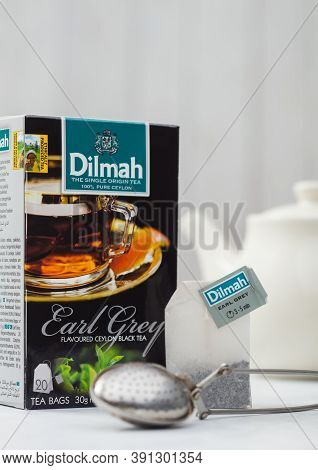 London, Uk - October 21, 2020: Dilmah Earl Grey Tea Bag And Box With Ceramic Teapot And Vintage Stra